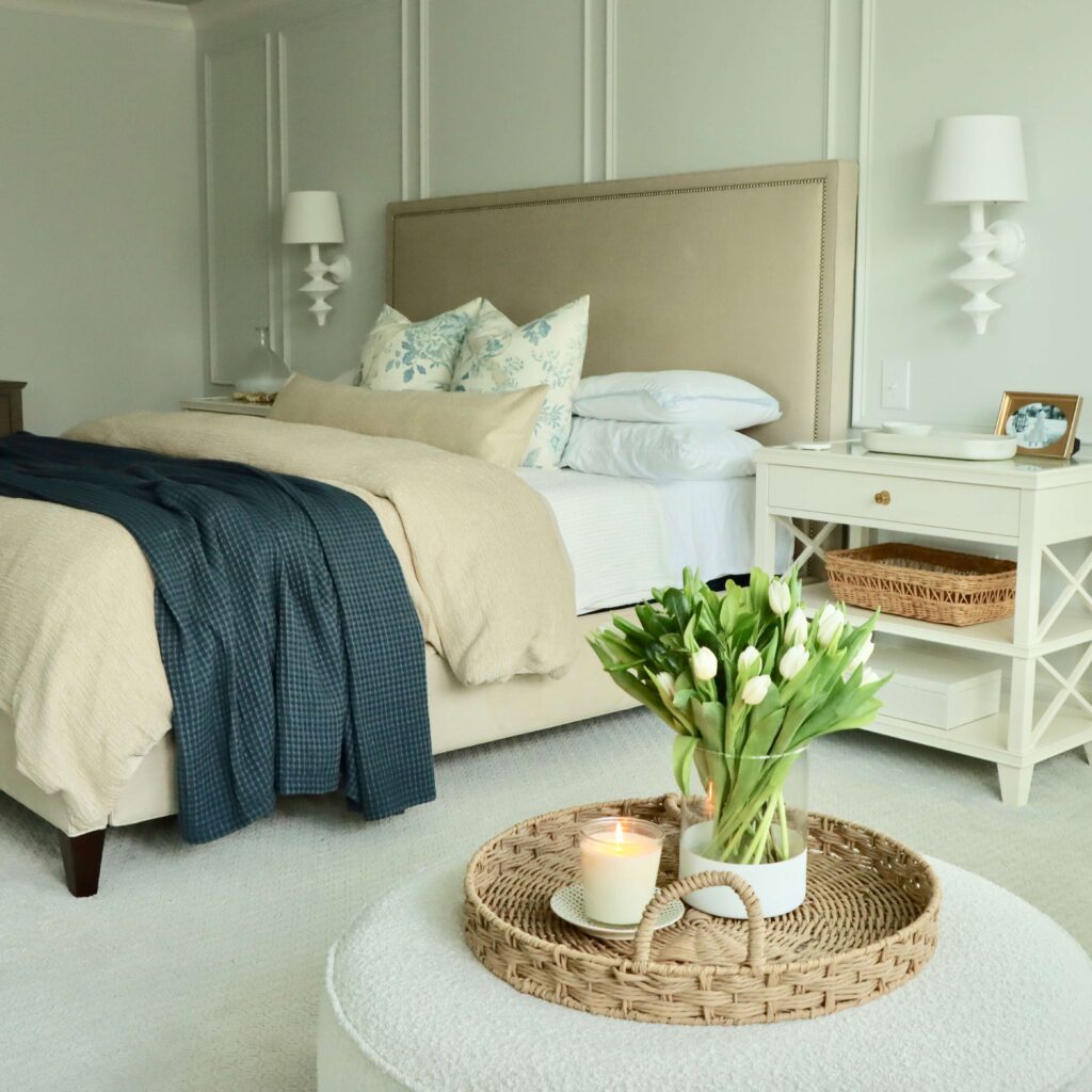 Modern open bedroom with nightstand and blue throw blanket