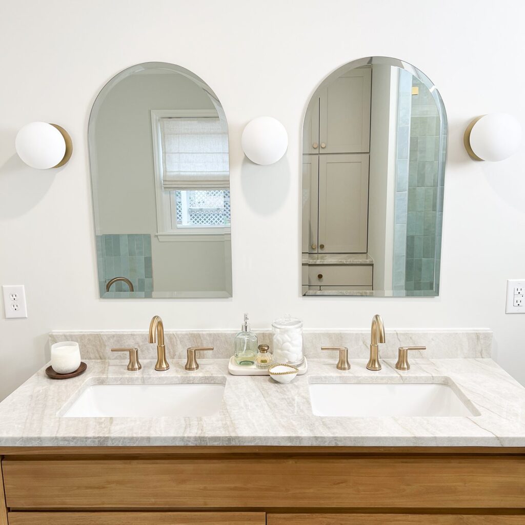 modern bathroom with two sinks and mirrors