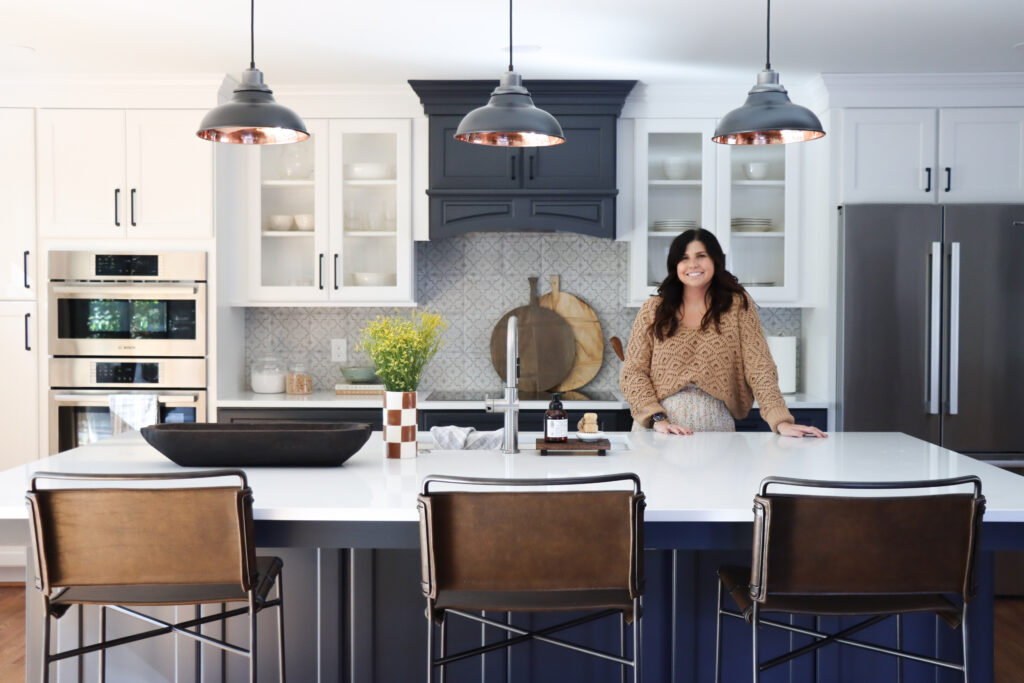 Hannah french in kitchen after design project in Currituck house