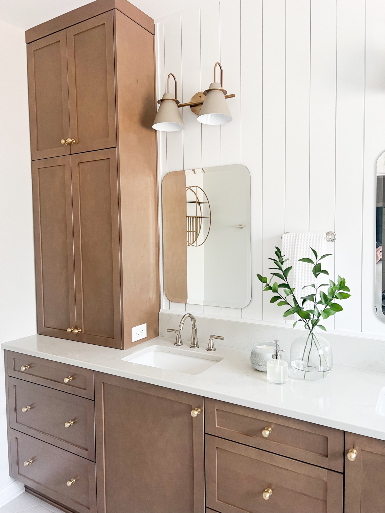 a bathroom with a mirror and sink