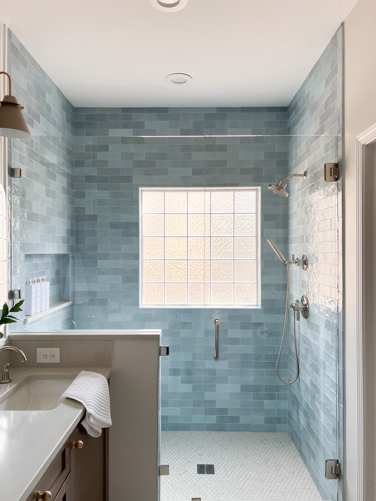 a bathroom with a shower and sink