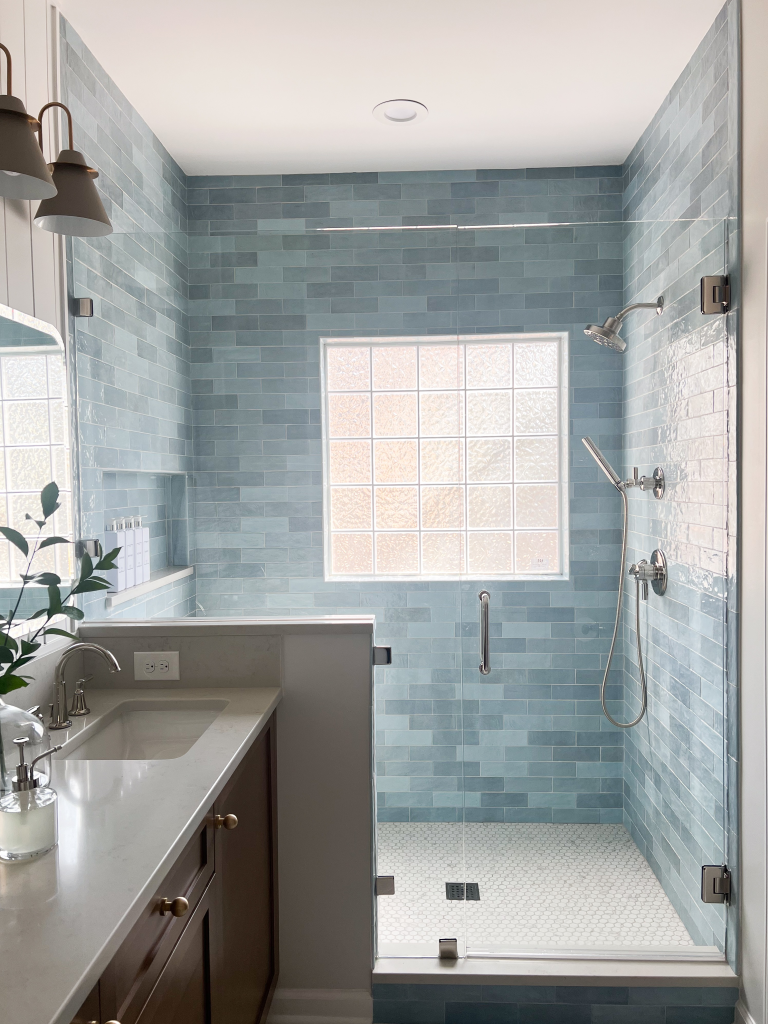 a bathroom with a shower and sink