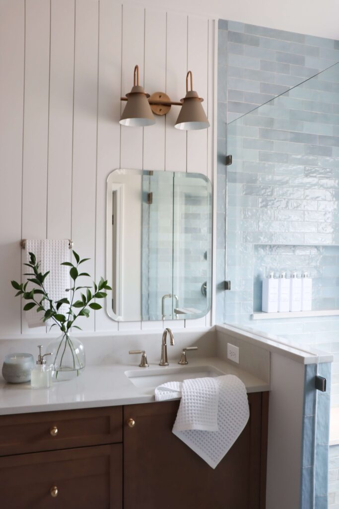 a bathroom with a mirror and sink