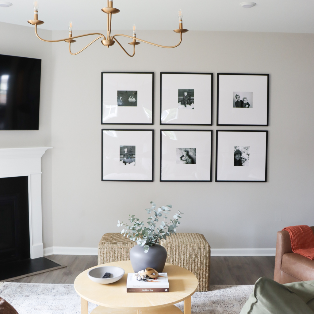 living room with photo gallery way in Lemon Chiffon Wake Forest house, designed by The Highpoint House