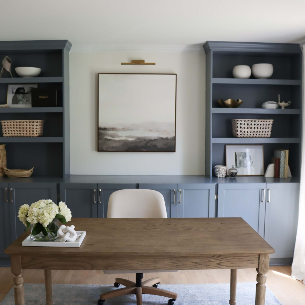 Blue bookcases with wooden desk designed by the Highpoint House in Raleigh, NC
