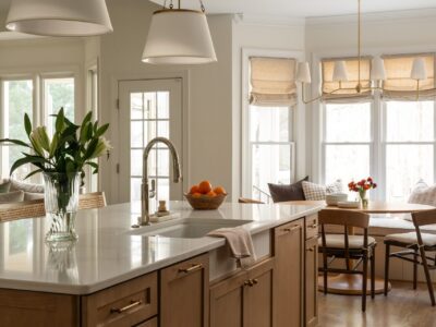 modern kitchen with white counters and wood cabinets